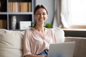 Adult Woman Smiling While at Computer